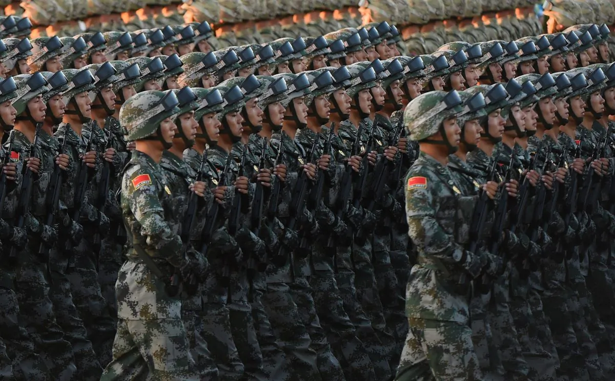 Chinese soldiers conduct a practice at dawn ahead of a military parade later in the morning at Tiananmen Square in Beijing on Sept. 3, 2015. (Greg Baker/AFP/Getty Images)