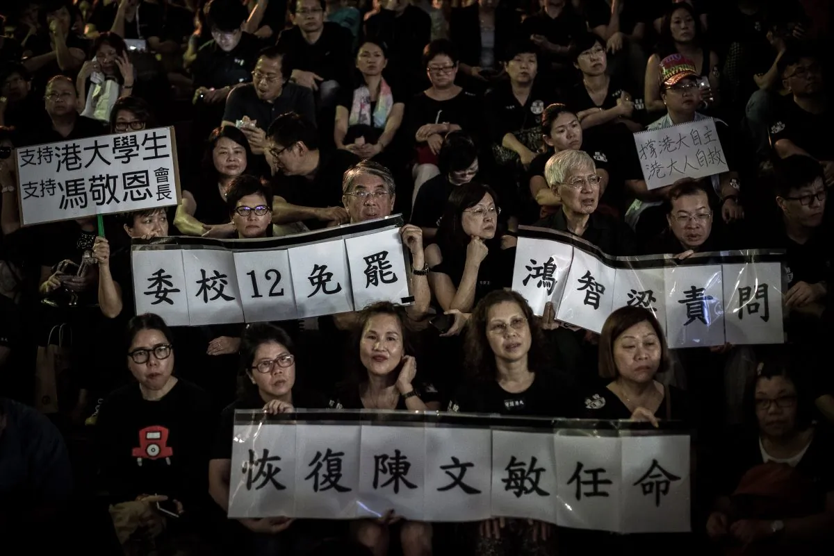 Protesters gather to call for academic freedom at Hong Kong University in Hong Kong on Oct. 9, 2015, as fears grow that Beijing is interfering in the city’s education system. More than 1,000 students, alumni, and teachers joined a protest at the university as anger mounted over the political interference. (Philippe Lopez /AFP/Getty Images)
