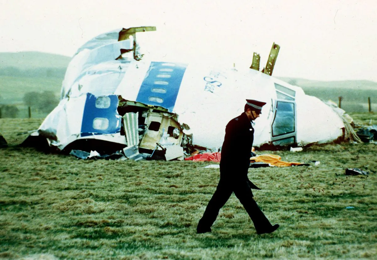 A police officer walks by the nose of Pan Am flight 103 in a field near the town of Lockerbie, Scotland, in this Dec. 21, 1988 file photo, where the wreckage lay after a bomb aboard exploded, killing a total of 270 people.  (Martin Cleaver, File/AP Photo)