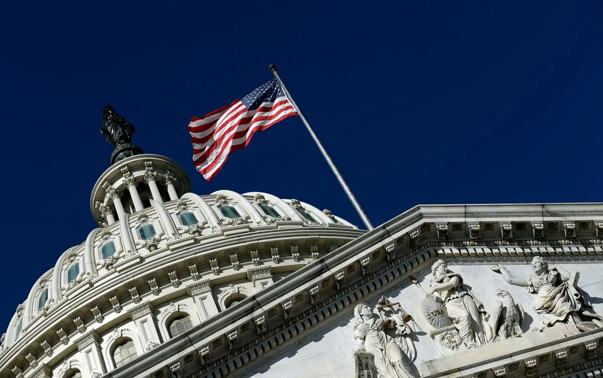 An American flag waves outside the U.S. Capitol Building in Washington, D.C., on Sept. 29, 2013. (Win McNamee/Getty Images)