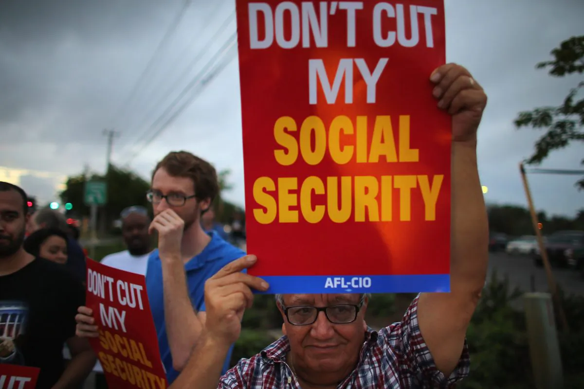 Virgilio Marquina and other protesters rally together outside the office of U.S. Sen. Marco Rubio (R-FL) in Doral, Fla., on December 10, 2012. (Joe Raedle/Getty Images)