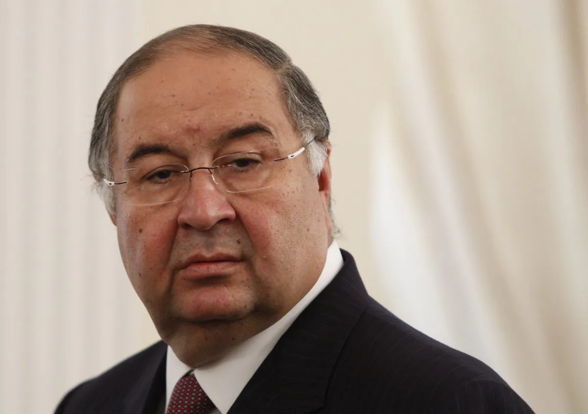 Uzbek-born Russian businessman Alisher Usmanov attends a meeting between Russian President Vladimir Putin and Crown Prince of Abu Dhabi Sheikh Abdullah bin Zayed al-Nahayan during their meeting at the Novo-Ogaryovo state residence outside Moscow September 12, 2013.  (Maxim Shemetov/AFP/Getty Images)