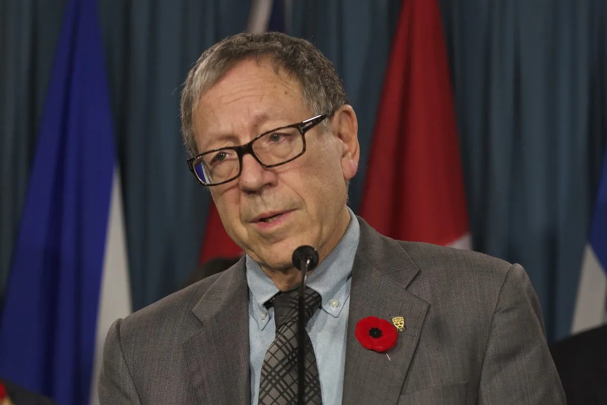 Canadian MP Irwin Cotler speaks during a press conference on Parliament Hill on Nov. 5, 2014. Cotler is exiting politics, but he hopes others in the new Parliament will reintroduce his bill on forced organ harvesting. (Matthew Little/Epoch Times)