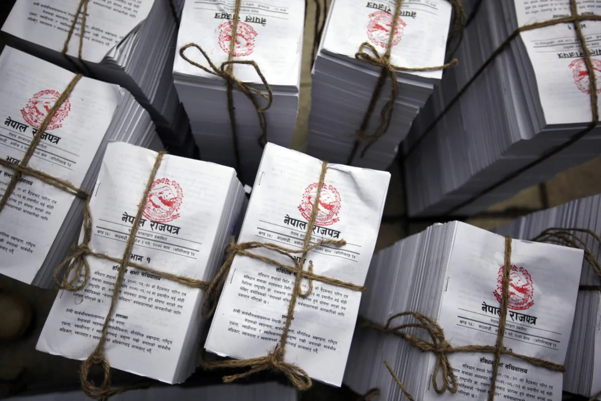 Copies of the Nepal's newly adopted constitution lie bundled together for distribution to lawmakers at the constituent assembly hall in Kathmandu, Nepal, on Sept. 20, 2015. (AP Photo/Niranjan Shrestha)