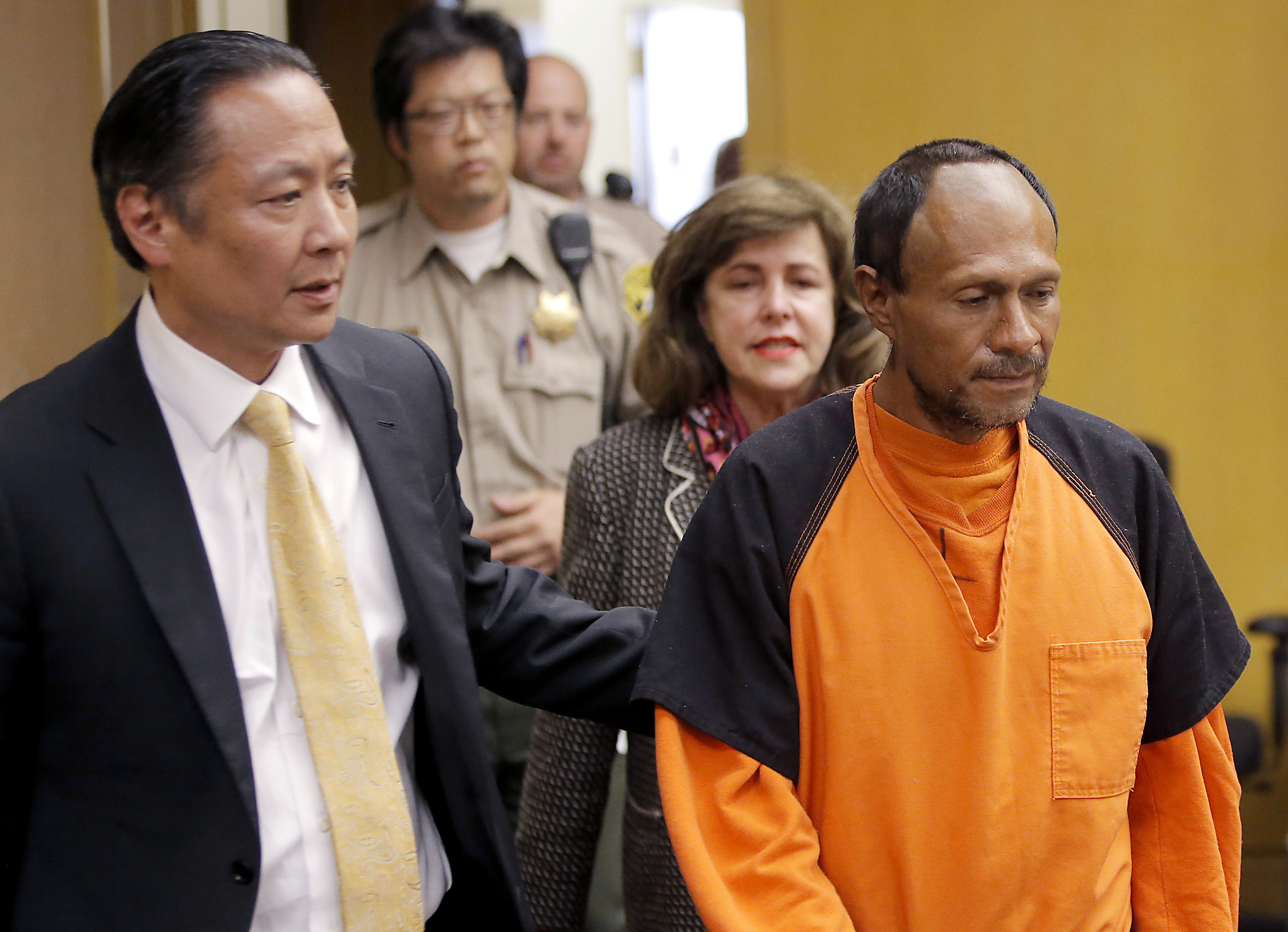Juan Francisco Lopez-Sanchez (R) is lead into the courtroom by San Francisco Public Defender Jeff Adachi (L) and Assistant District Attorney Diana Garciaor (C), for his arraignment at the Hall of Justice in San Francisco. Juan, an illegal immigrant with seven felony convictions in the U.S. and previously deported to Mexico five times, fatally shot 32-year-old Kate Steinle on July 1. (Michael Macor/San Francisco Chronicle via AP)