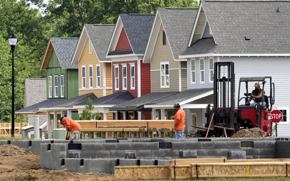Builders work on a home under construction in the Briar Chapel community of Chapel Hill, N.C., on June 9, 2015. (AP Photo/Gerry Broome)