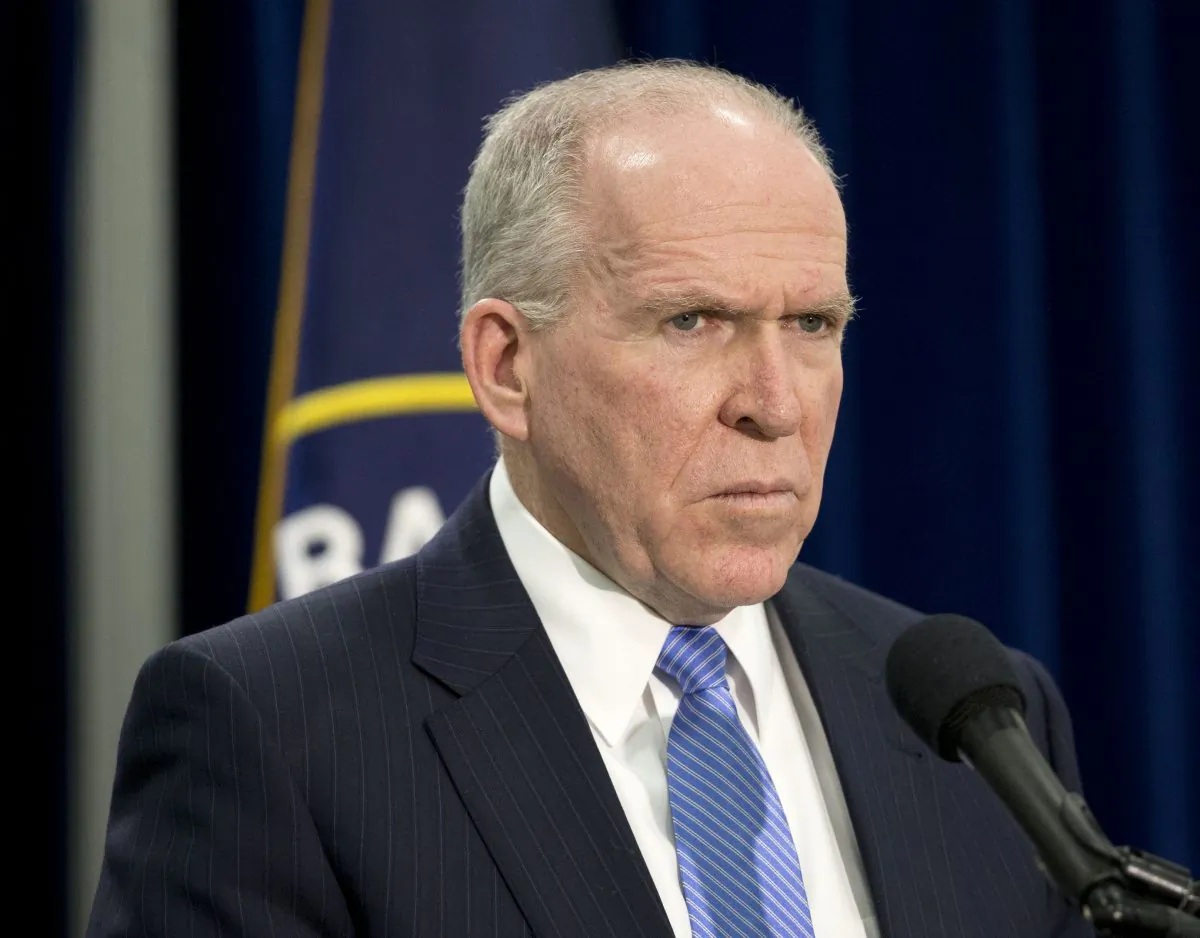 CIA Director John Brennan listens during a news conference at CIA headquarters in Langley, Va., on Dec. 11, 2014. (AP Photo/Pablo Martinez Monsivais)