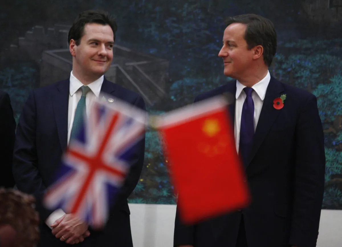 U.K. Prime Minister David Cameron (R) and Chancellor George Osborne at a signing ceremony at the Great Hall of the People in Beijing, China, on Nov. 9, 2010. (Petar Kujundzic/AFP/Getty Images)
