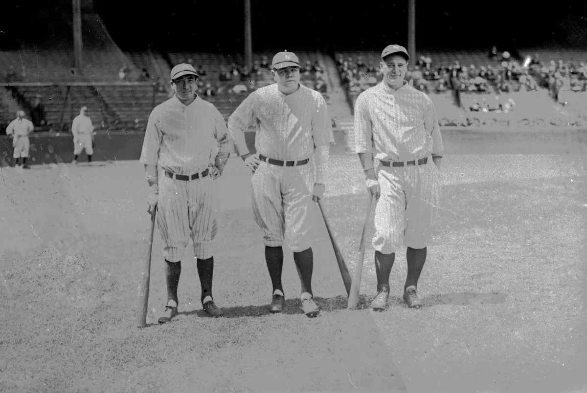 Home run king Babe Ruth of the New York Yankees, center, is seen with teammates Tony Lazzeri, left, and Lou Gehrig, right, June 1927 in New York. (AP Photo) 