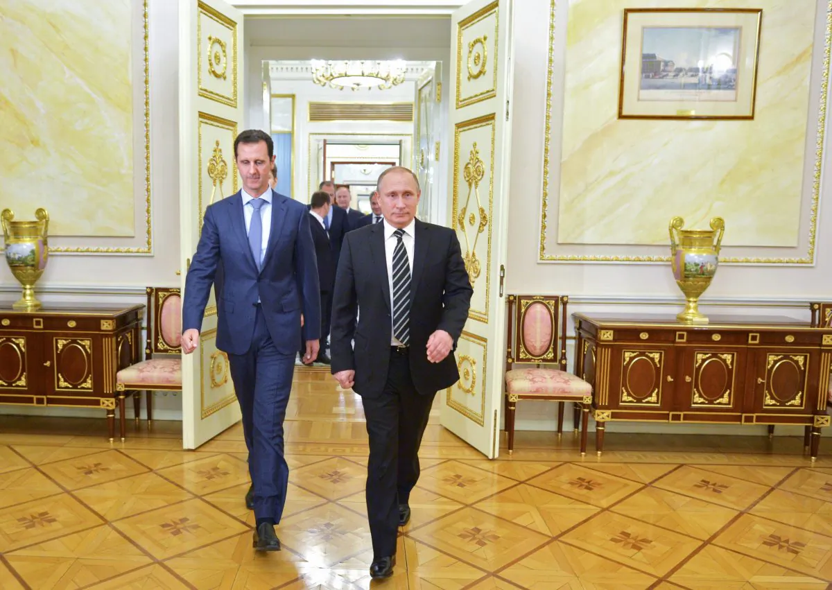 Russian President Vladimir Putin (R) and Syria President Bashar Assad arrive for their meeting in the Kremlin in Moscow, Russia, on Oct. 20, 2015. (Alexei Druzhinin/RIA-Novosti via AP)
