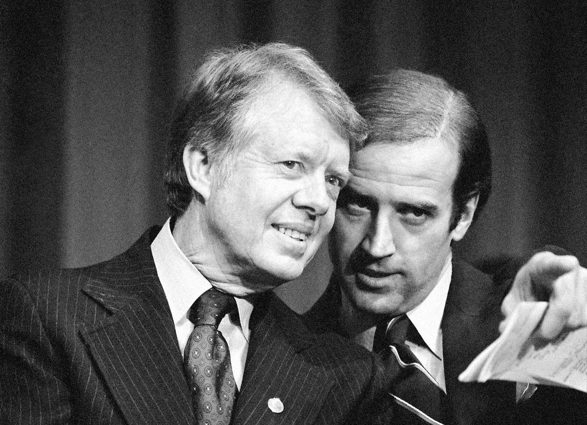 President Jimmy Carter listens to Sen. Joseph R. Biden (D-Del.), as they wait to speak at a fundraising reception at Padua Academy in Wilmington, on Feb. 20, 1978. (Barry Thumma/AP Photo)