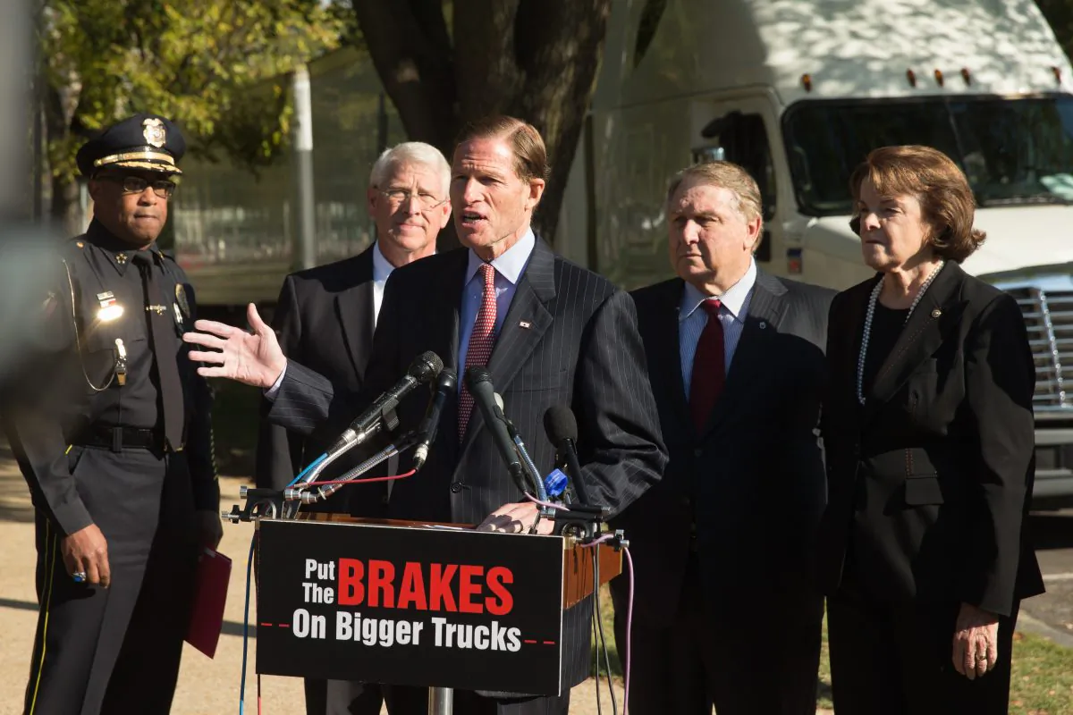 Sen. Richard Blumenthal (D-Conn.) (C), accompanied by, (L-R), Vicksburg, Miss. Police Chief Walter Armstrong, Sen. Roger Wicker (R-Miss.), International Brotherhood of Teamsters President James P. Hoffa, and Sen. Dianne Feinstein (D-Calif.), at a news conference on the West Front of the Capitol in Washington, D.C., on Oct. 21, 2015, to discuss bipartisan opposition to a federal mandate that would allow large trucks to pull double 33-foot trailers on the nation’s highways. (AP Photo/Andrew Harnik)