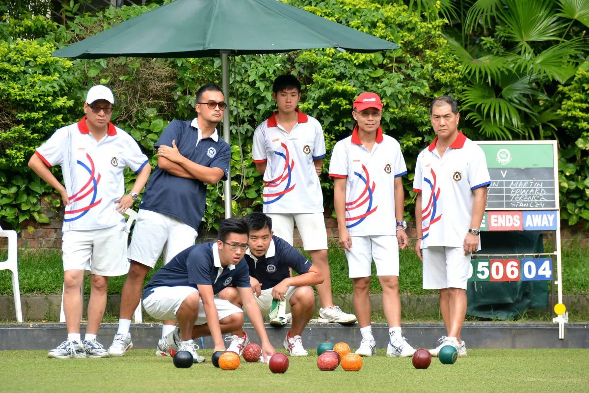 The Craigengower Cricket Team (in blue) stays focused during their postponed match against league leader Kowloon Bowling Green Club. CCC can only finished the game 2-6 and may miss the title again this year. (Mike Worth)