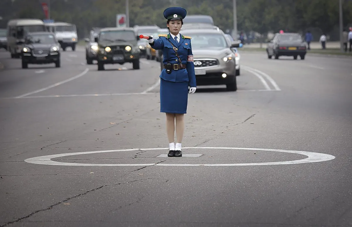 A North Korean traffic police officer mans her position while directing traffic on Thursday, Oct. 8, 2015, in Pyongyang, North Korea. (AP Photo/Wong Maye-E)