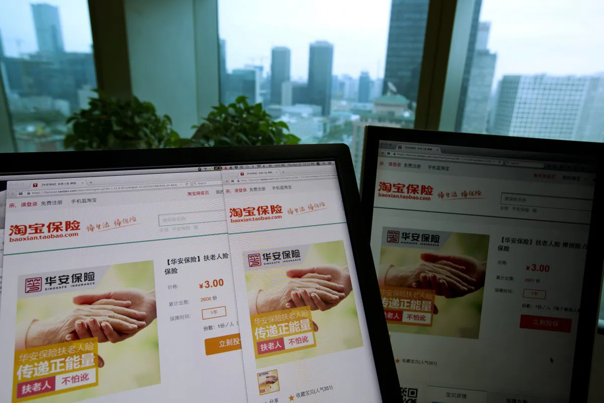 An e-commerce website by Alibaba and Hua'an insurance, also known as Sinosafe Insurance, selling an insurance product to protect good Samaritans from being scammed by elderly people they help is displayed on computer screens in Beijing, Thursday Oct. 22, 2015. (AP Photo/Ng Han Guan)