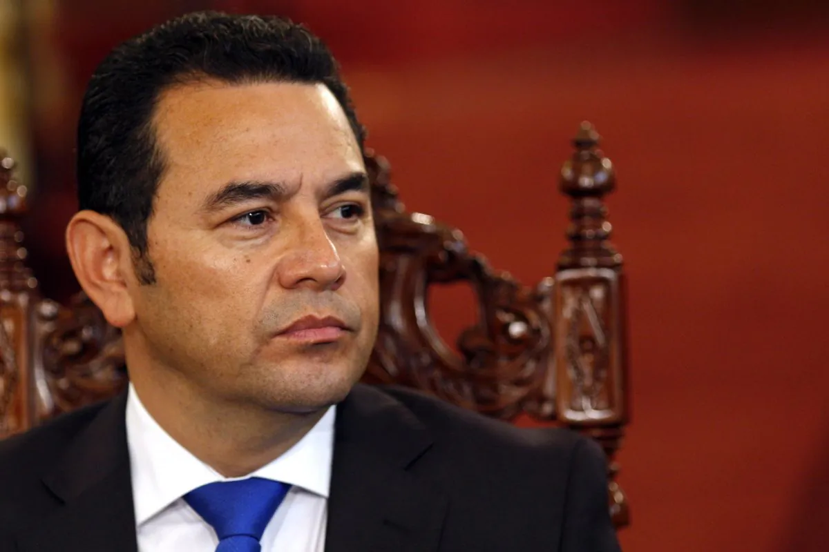 Comedian Jimmy Morales, who's running for president with the National Front of Convergence party, attends a meeting at the National Palace with his rival to sign an agreement to respect governmental institutions ahead of the election in Guatemala City, Thursday, Oct. 22, 2015. (AP Photo/Luis Soto)