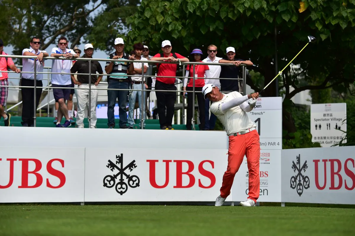 Lu Wei-chih of Taiwan continued his good form and goes into the weekend at 7 under par (133), drives off the 1st tee (his 9th) during the second round of the UBS Hong Kong Open 2015, at Fanling on Friday Oct 23, 2015. (Bill Cox/Epoch Times)