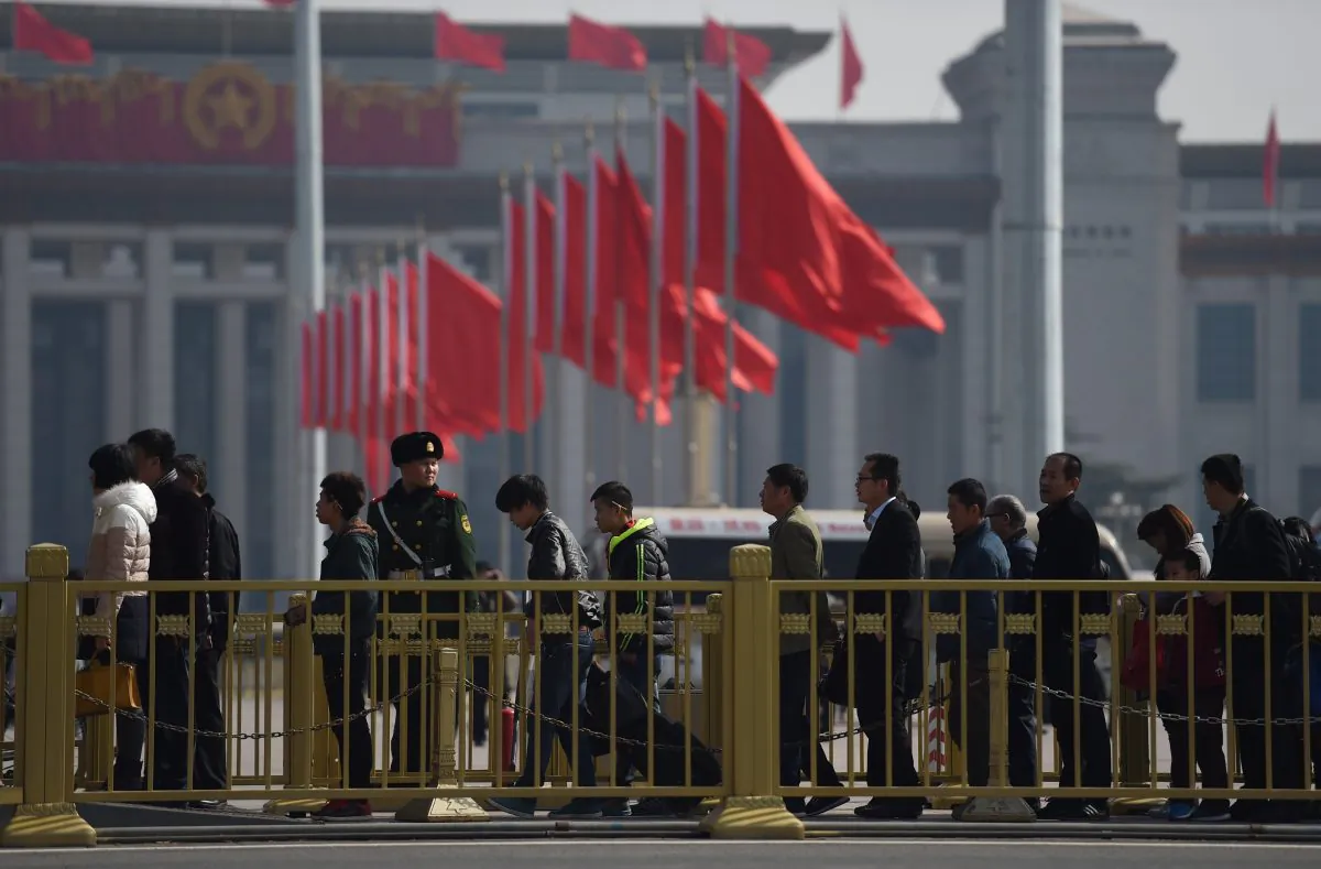 Visitors line up to enter Tiananmen Square, next to the Great Hall of the People, the venue for upcoming meetings of China's legislature in Beijing on March 2, 2015. (Greg Baker/AFP/Getty Images)