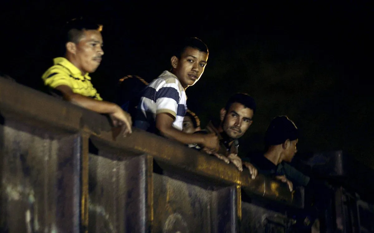 Migrants travel on board of a train in Palenque, Chiapas state, Mexico, on June 20, 2015. Hundreds of Central American migrants arrive in Mexico on their way to the United States. (Alfredo Estrella/AFP/Getty Images)
