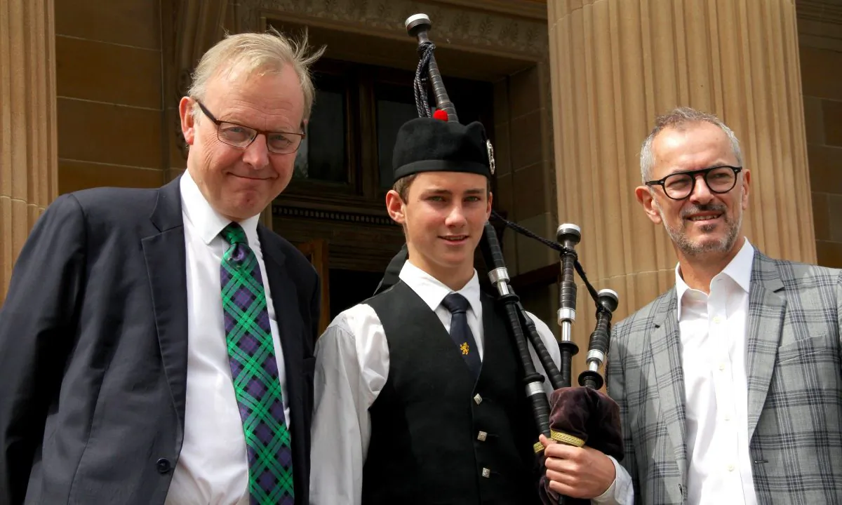 (L toR) Michael Clarke, director of the Scottish National Gallery, The Scots College piper Matthew McGowan and Michael Brand, director of The Art Gallery of New South Wales at the opening of 'The Greats' Friday, Oct. 23, 2015. (Shar Adams/Epoch Times)