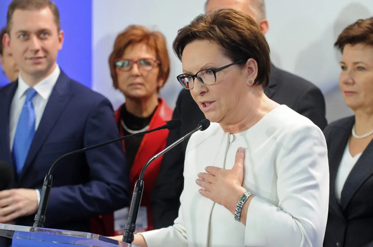 Polish Prime Minister Ewa Kopacz addresses supporters after the first exit polls were announced following general elections in Warsaw, Poland, Sunday, Oct. 25, 2015. (AP Photo/Alik Keplicz)