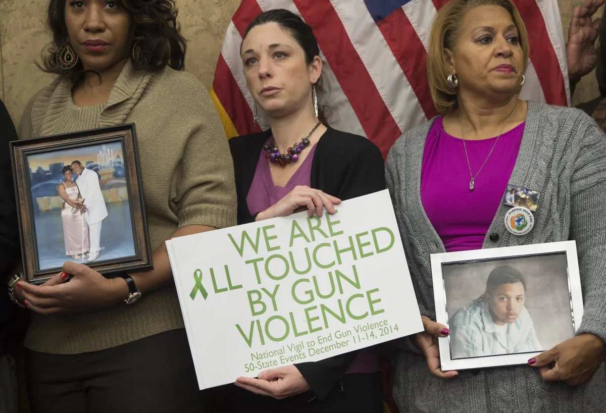 Relatives of victims of gun violence and gun violence prevention advocates during a press conference to honor the second anniversary of the shootings at Sandy Hook Elementary School in Newtown, Connecticut, at the US Capitol, on Dec. 10, 2014. (Saul Loeb/AFP/Getty Images)