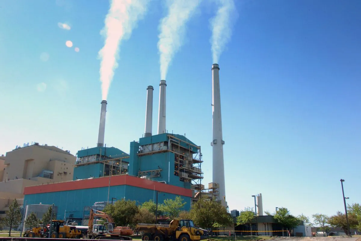 Smoke rises from the Colstrip Steam Electric Station, a coal burning power plant in in Colstrip, Mont., on July 1, 2013. (AP Photo/Matthew Brown)