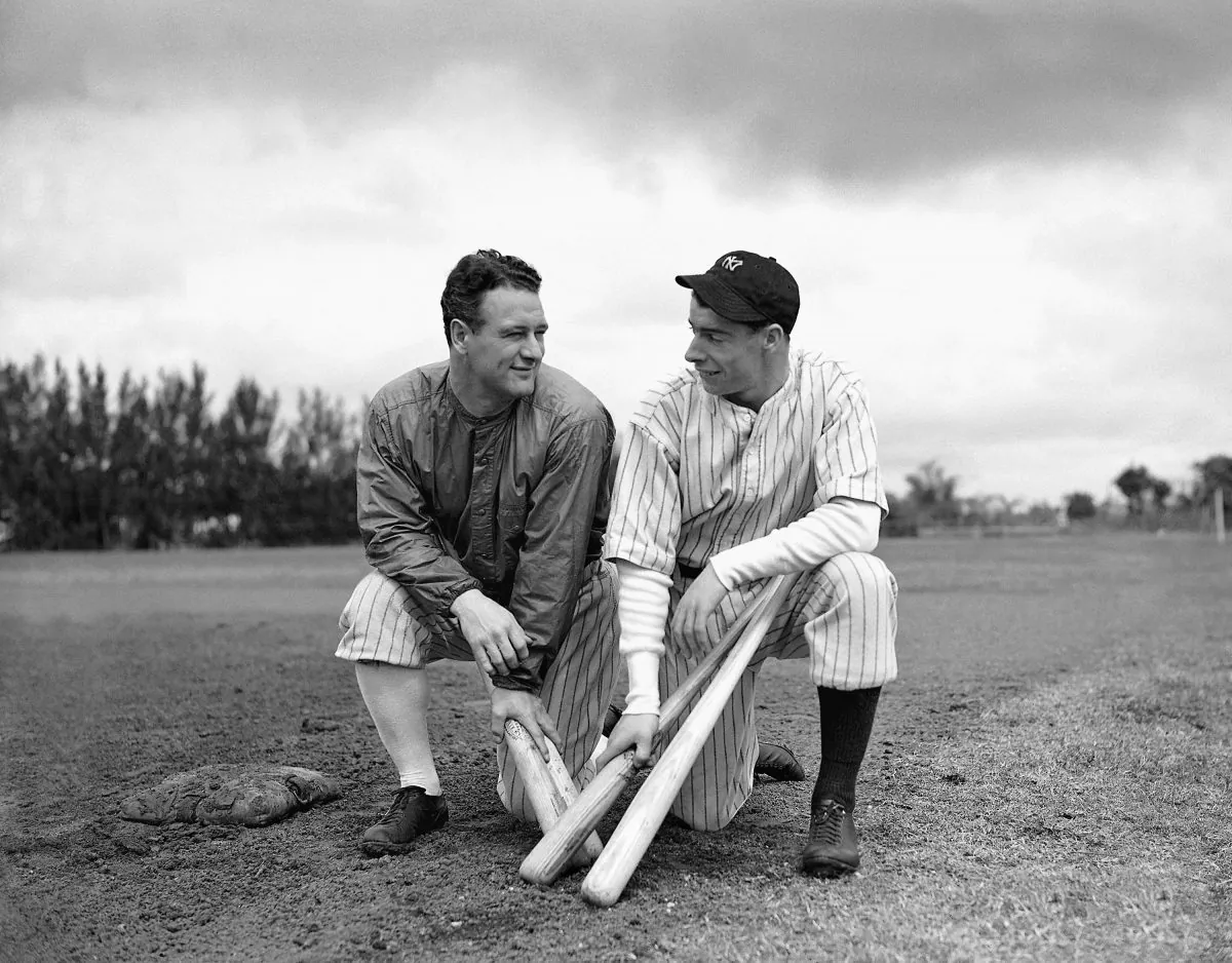 Lou Gehrig (L) gets something like a smile from rookie sensation Joe DiMaggio during spring training in St. Petersburg, Fla., March 8, 1936. DiMaggio, purchased from the San Francisco Seals, had earned a reputation for being shy and reserved since joining the Yankees in Florida. (AP Photo) 