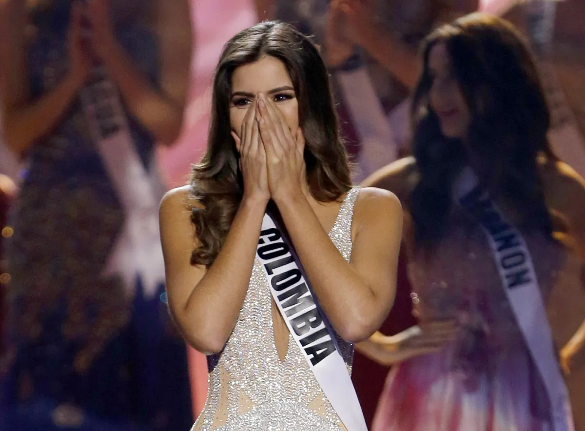 Miss Colombia Paulina Vega reacts after being named Miss Universe at the Miss Universe pageant in Miami on Jan. 25, 2015. The Fox network has picked up "The 64th Annual Miss Universe Pageant" and domestic rights to air "Miss USA."  The three-hour "Miss Universe" will air live from Las Vegas on Dec. 20, the Miss Universe Organization and IMG, its new owner, said Wednesday. "Miss USA" will air on Fox in 2016. (AP Photo/Wilfredo Lee)