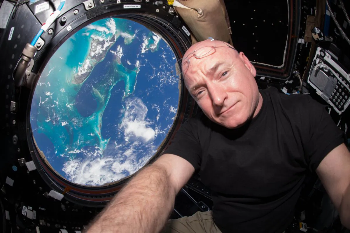 Astronaut Scott Kelly poses for a selfie photo in the "Cupola" of the International Space Station on July 12, 2015. On Friday, Oct. 16, 2015, Kelly broke the U.S. record for the most time spent in space Friday—383 days. (Scott Kelly/NASA via AP)