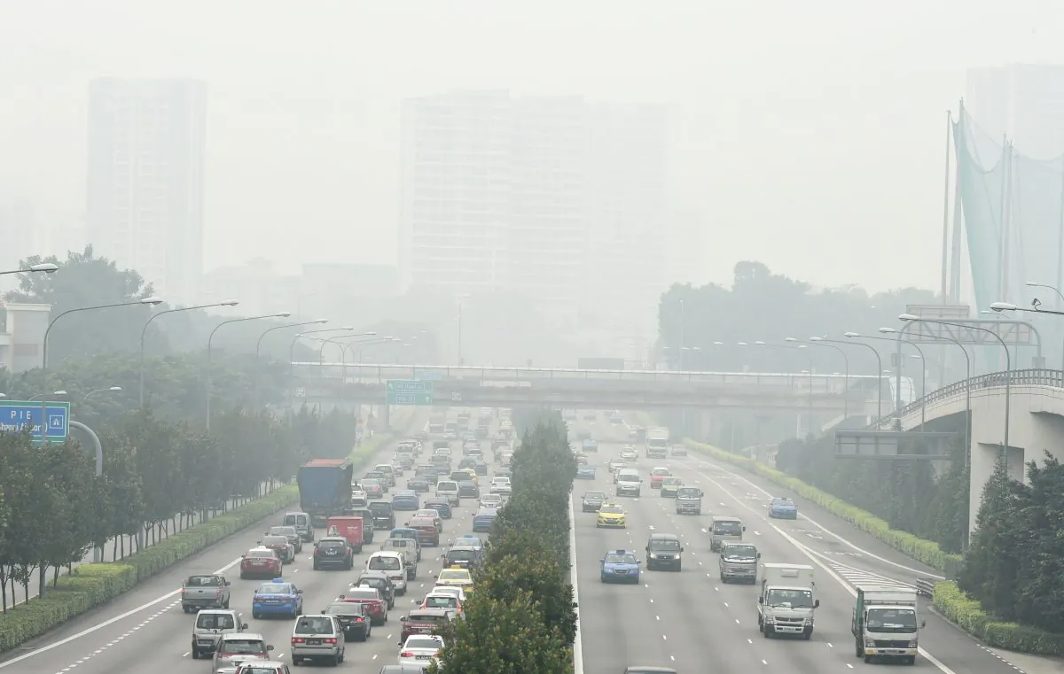 Motorists ply along Singapore's central expressway blanketed by smog from agricultural fires in neighbouring Sumatra island in Indonesia on September 29, 2015. The Pollutant Standards Index, which measures air quality, climbed to "very unhealthy" levels in Singapore, according to the National Environment Agency. (ROSLAN RAHMAN/AFP/Getty Images)