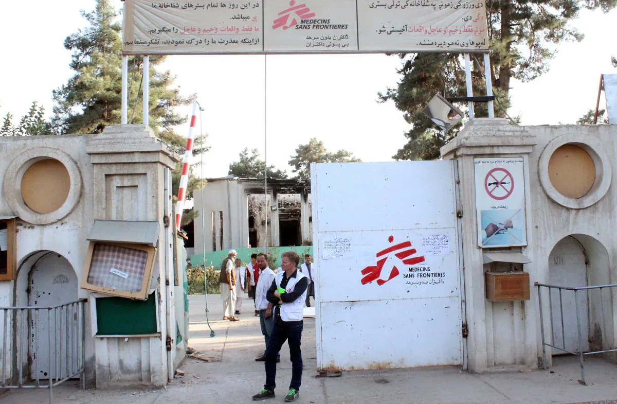 In this Oct. 15, 2015 file photo, Christopher Stokes, the general director of medical charity Doctors Without Borders, which is also known by its French abbreviation MSF, stands at the gate of the organization's hospital, after it was hit by a U.S. airstrike in Kunduz, Afghanistan. (Najim Rahim via AP)