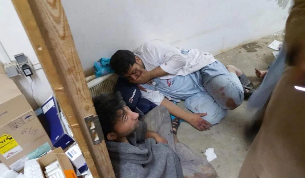 In this Oct. 3, 2015 file photo, provided by Doctors Without Borders, injured Doctors Without Borders staff are seen near their hospital after it was hit by a U.S. airstrike, in the northern Afghan city of Kunduz, Afghanistan. (Medecins Sans Frontieres via AP)