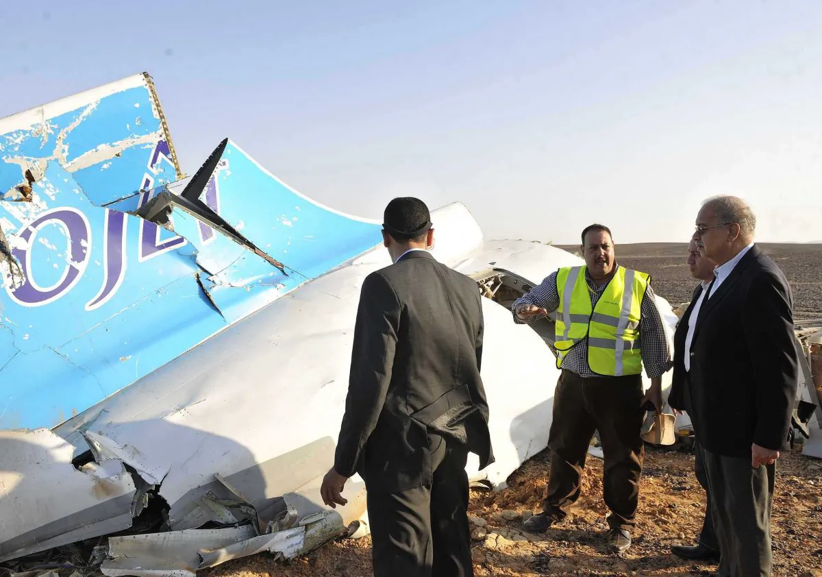Egypt's Prime Minister Sherif Ismail (R) at the site of the wreckage of the crashed A321 Russian airliner in Wadi al-Zolomat in Hassana Province, a mountainous area of Egypt's Sinai Peninsula, on Oct. 31, 2015. A Russian aircraft carrying 224 people crashed Saturday in the region about 20 minutes after taking off from a Red Sea resort Sharm el-Sheikh in south Sinai bound for Saint Petersburg. There were no survivors. (Suliman al-Oteify/AFP/Getty Images)
