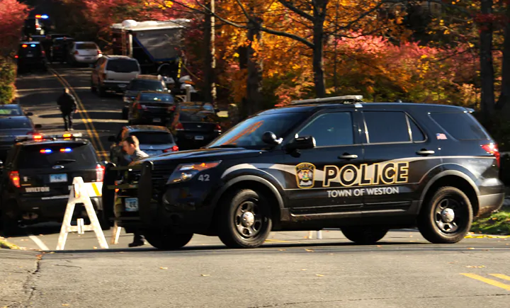 State Police search the area around a home in Weston, Conn., on Oct. 30, 2015, reportedly belonging to a friend of Kyle Navin. Possible human remains were found during the search and may be linked to the disappearance of missing Easton couple, Jeanette and Jeffery Navin, Kyle Navin's parents. (Cathy Zuraw/Hearst Connecticut Media via AP)