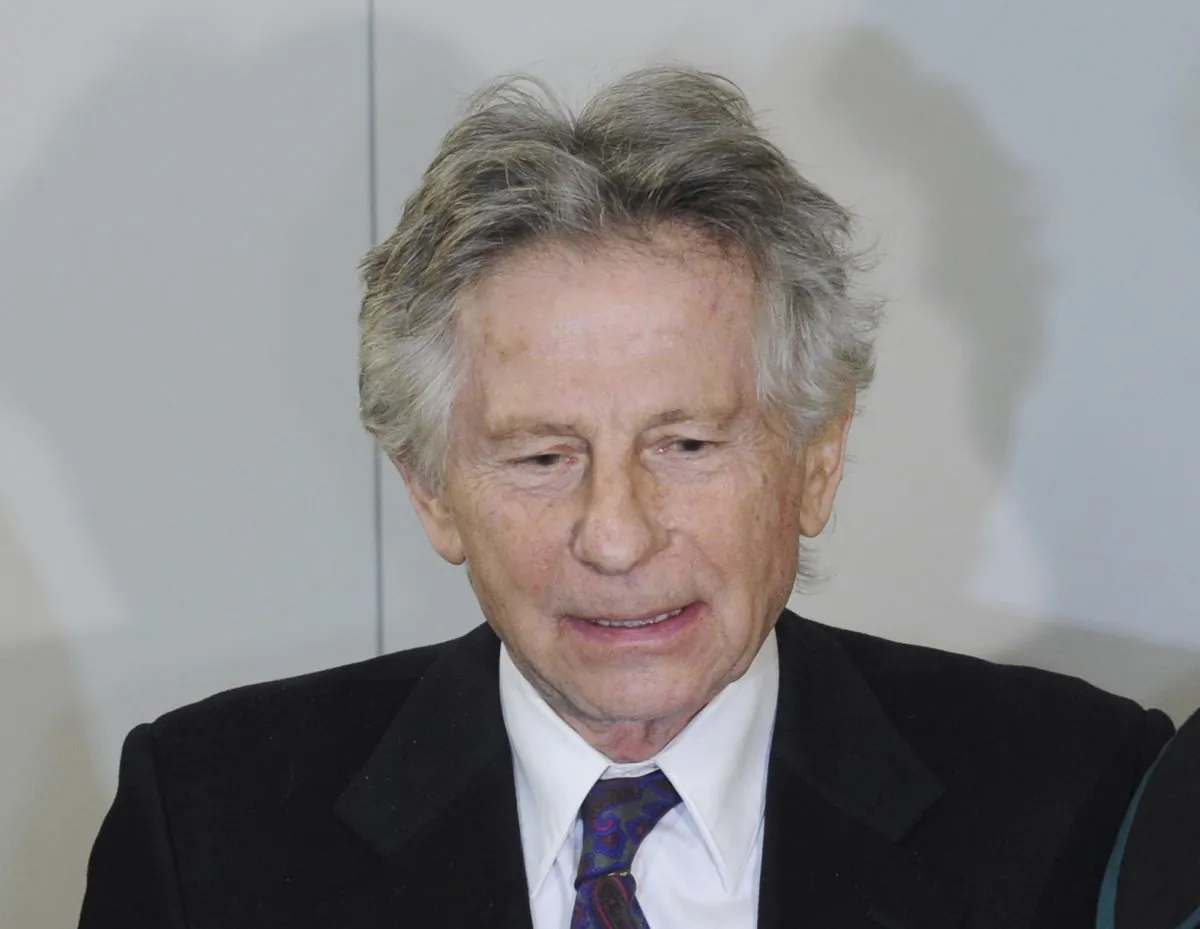 Roman Polanski speaks to the press after a hearing concerning a U.S. request for his extradition over 1977 charges of sex with a minor, at the regional court in his childhood city of Krakow, Poland, on Feb. 25, 2015. A court in Poland was expected to rule Friday, Oct. 30, 2015, on whether Polish law allows filmmaker Roman Polanski to be extradited to the U.S., where he pleaded guilty nearly four decades ago to having sex with a minor. (AP Photo/Alik Keplicz)