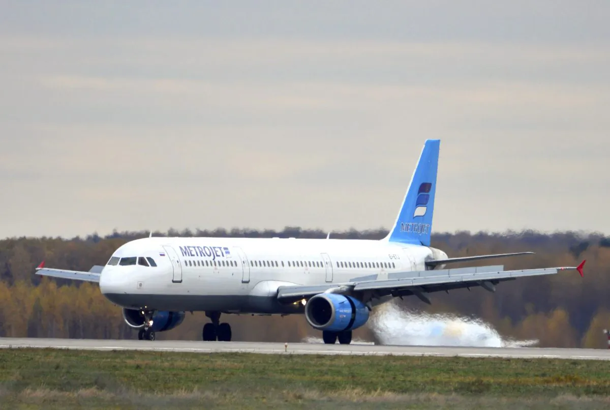 The Russian airline Kogalymavia’s Airbus A321 with a tail number of EI-ETJ on an airstrip of Moscow’s Domodedovo international airport, outside Moscow, Russia, on Oct. 20, 2015. Russia's civil air agency is expected to have a news conference shortly to talk about the Russian Metrojet passenger plane EI-ETJ, that Egyptian authorities say has crashed in Egypt's Sinai peninsula. (AP Photo/Tatiana Belyakova)
