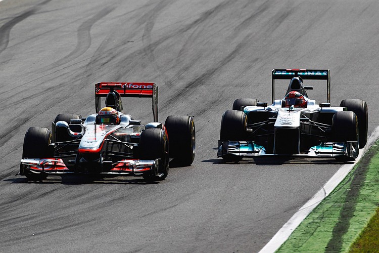 Lewis Hamilton (L) finally gets by Michael Schumacher (R) during the Formula One Italian Grand Prix. (Paul Gilham/Getty Images) Lewis Hamilton (L) finally gets by Michael Schumacher (R) during the Formula One Italian Grand Prix. (Paul Gilham/Getty Images)
