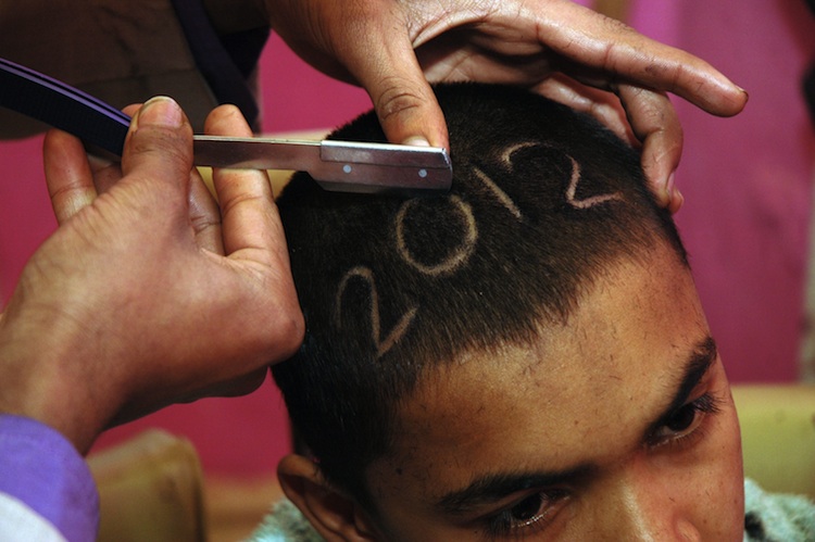 A Pakistani barber gives a 2012 hair cut