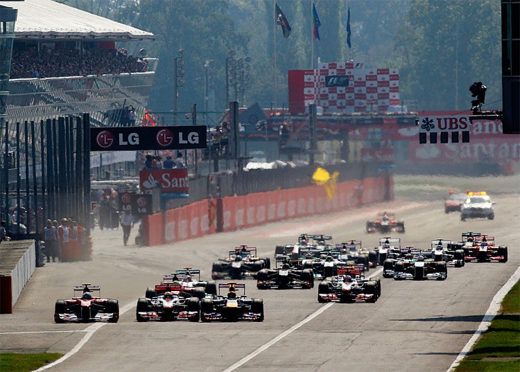 Fernando Alonso (L) passes Lewis Hamilton (2L) and Sebastian Vettel (3L) at the start of the Formula One Italian Grand Prix at the Autodromo Nazionale di Monza. (Paul Gilham/Getty Images) Fernando Alonso (L) passes Lewis Hamilton (2L) and Sebastian Vettel (3L) at the start of the Formula One Italian Grand Prix at the Autodromo Nazionale di Monza. (Paul Gilham/Getty Images)