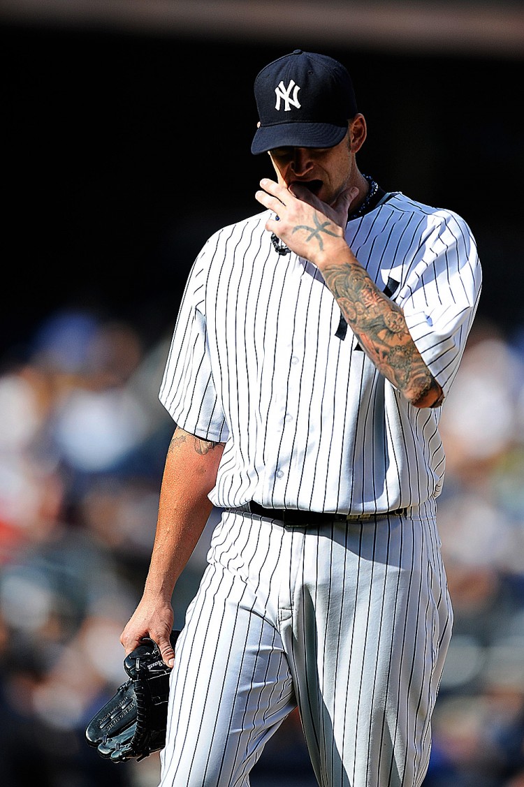 NOT WHAT HE WANTED: Yankees' starter A.J. Burnett leaves the game after an uneven performance against the Twins' unimposing lineup. The 34-year-old right-hander who narrowly escaped the fourth frame after striking out the side in both the second and third (Patrick Mcdermott/Getty Images) NOT WHAT HE WANTED: Yankees' starter A.J. Burnett leaves the game after an uneven performance against the Twins' unimposing lineup. The 34-year-old right-hander who narrowly escaped the fourth frame after striking out the side in both the second and third (Patrick Mcdermott/Getty Images)