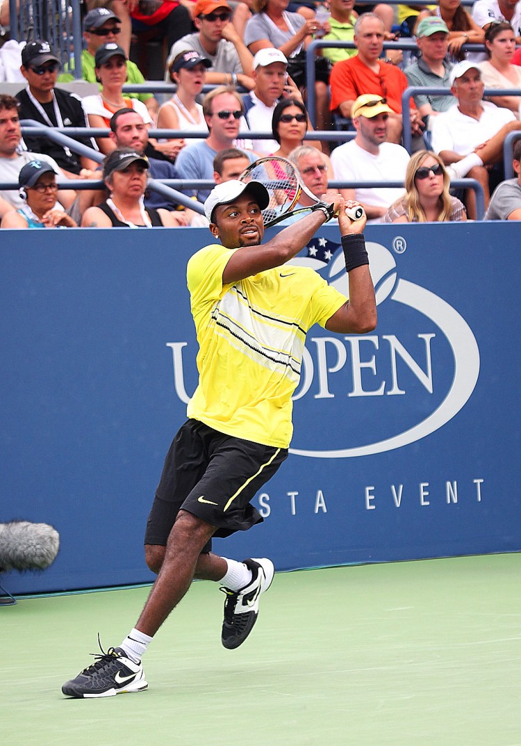 REALIZING PROMISE: Donald Young drives a backhand return towards Juan Ignacio Chela during their men's singles match on Grandstand Court at the US Open Sunday. (Gary Du/The Epoch Times) REALIZING PROMISE: Donald Young drives a backhand return towards Juan Ignacio Chela during their men's singles match on Grandstand Court at the US Open Sunday. (Gary Du/The Epoch Times)