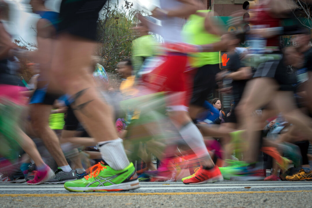 Runners compete in the New York City Marathon, Sunday, Nov. 1, 2015, in the Brooklyn borough of New York. (AP Photo/Bryan R. Smith)