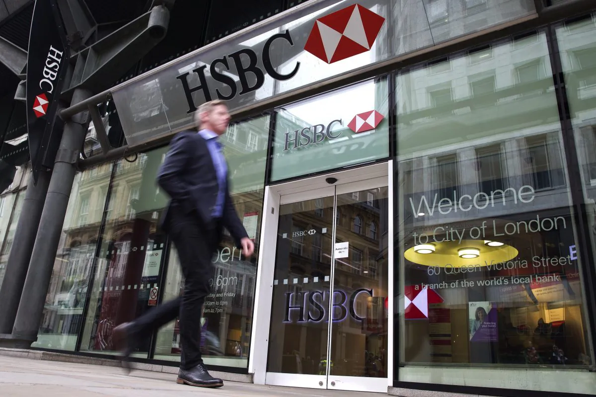 A businessmen walks past the entrance to a HSBC bank branch in London, on June 9, 2015. (Justin Tallis/AFP/Getty Images)