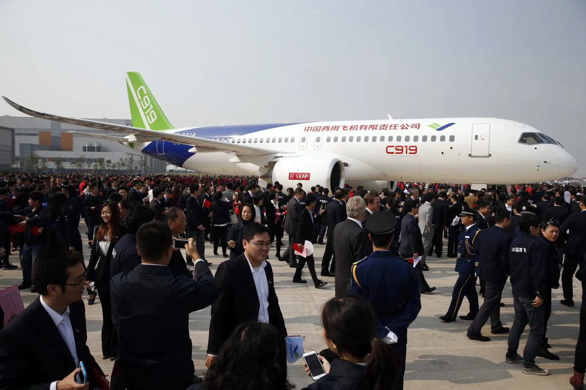 The Chinese regime unveils the C919, its first large passenger plane, in Shanghai on Nov. 2, 2015. (STR/AFP/Getty Images)
