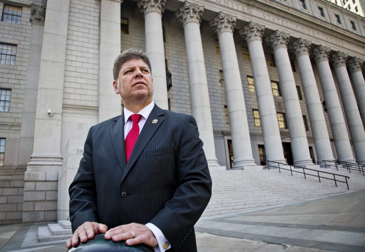 U.S. Marshall Director Michael Greco pose outside near courts the agency is responsible for, Thursday, Oct. 8, 2015, in New York. (AP Photo/Bebeto Matthews)