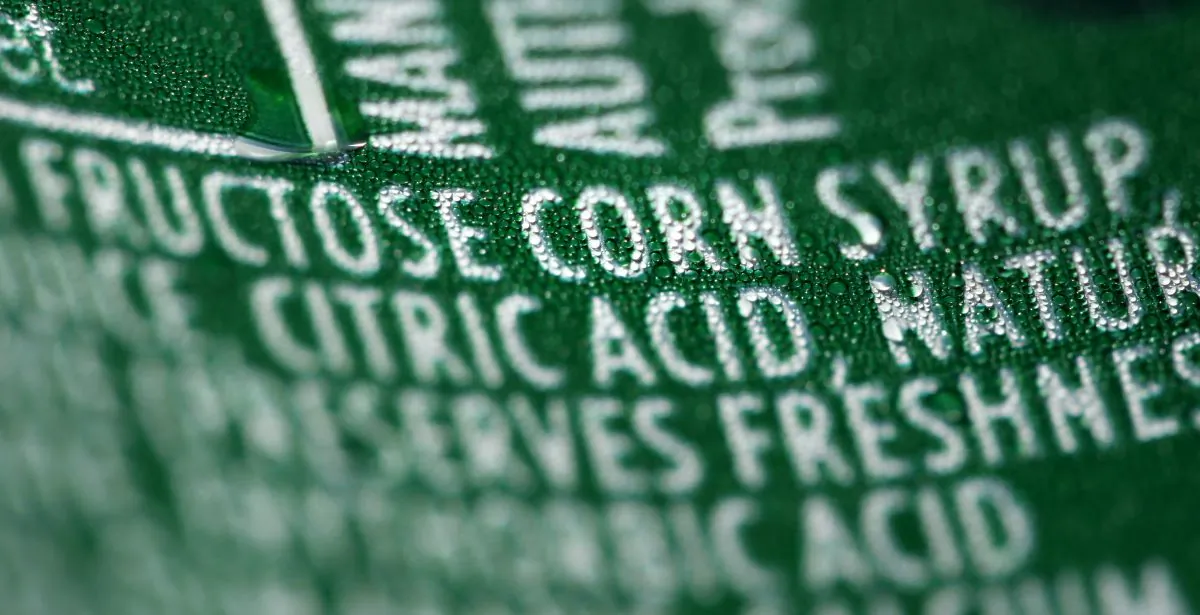 A nutrition label that lists high fructose corn syrup as an ingredient in a can of soda, in Philadelphia, on Sept. 15, 2011. In a trial starting Tuesday, Nov. 3, 2015, jurors in the case between sugar processors and corn manufacturers will take up one of nutrition’s most vexing debates and confront a choice common among some consumers: sugar or high fructose corn syrup? (AP Photo/Matt Rourke)