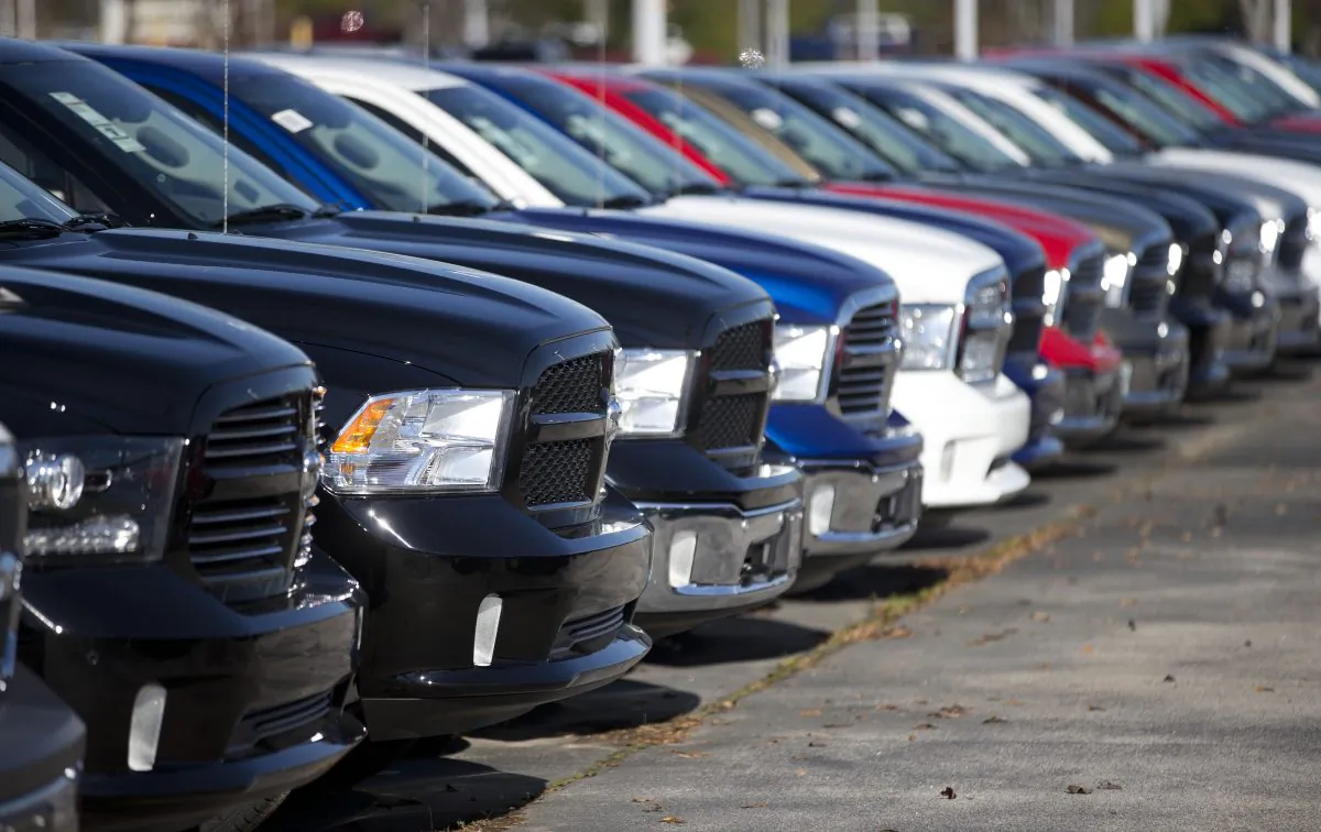 Ram pickup trucks are on display on the lot at Landmark Dodge Chrysler Jeep RAM in Morrow, Ga., on Jan. 5, 2015. Fiat Chrysler sold almost 41,000 Rams in October 2015, the company reported Tuesday, Nov. 3, 2015, a 3 percent gain over a year ago for FCA’s top-selling vehicle. (AP Photo/John Bazemore)