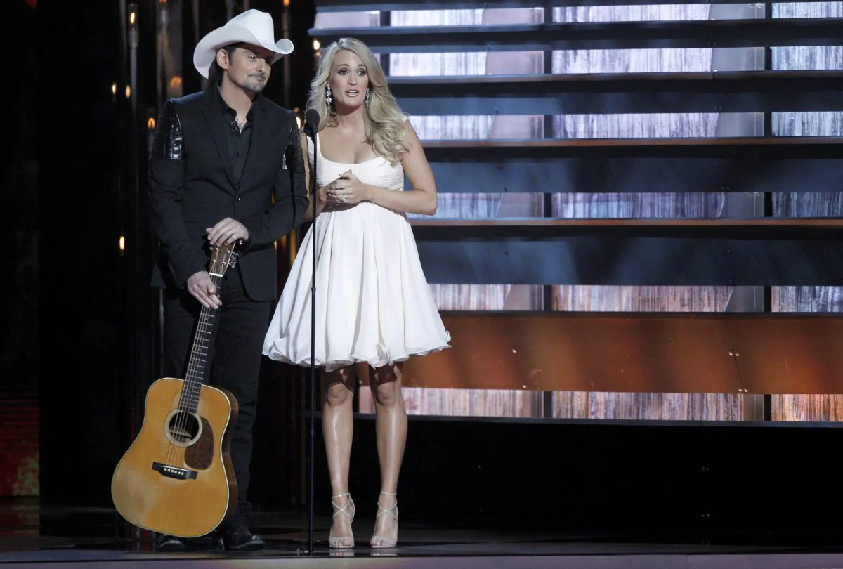 Hosts Brad Paisley (L) and Carrie Underwood appear at the 48th annual CMA Awards in Nashville, Tenn., on Nov. 5, 2014. The pair return to host another CMA Awards event, Wednesday, Nov. 4, 2015, which includes three days of rehearsals. (Wade Payne/Invision via AP)