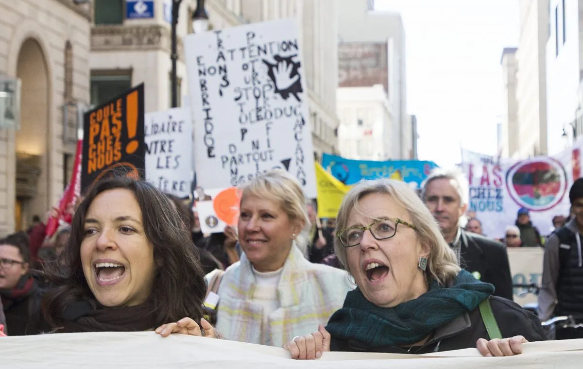 Green Party leader Elizabeth May (R) participates in a No to Energy East and Line 9B Pipelines demonstration during a federal election campaign stop in Montreal on Oct. 10, 2015. A bid by TransCanada Corp. to suspend its controversial north-south Keystone XL pipeline proposal has elevated the west-east Energy East pipeline plan to the top of Canada's political agenda. (The Canadian Press/Graham Hughes)